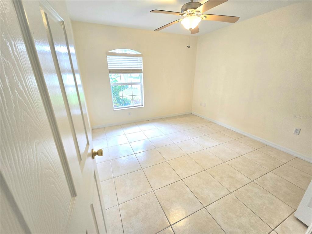 820 Shamrock Drive Sebring, FL 33875 - Photo 15 of 38 a view of an empty room with a window