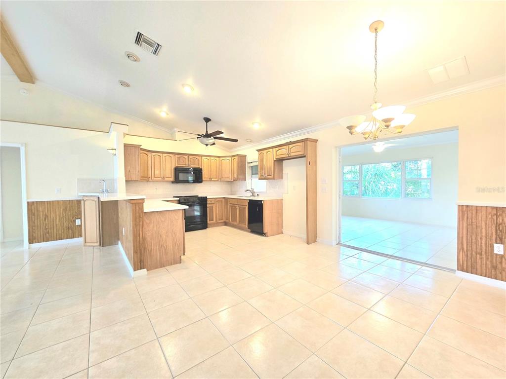 820 Shamrock Drive Sebring, FL 33875 - Photo 7 of 38 a view of a kitchen with kitchen island and stainless steel appliances
