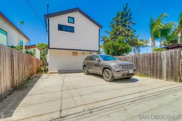 a car parked in front of a house