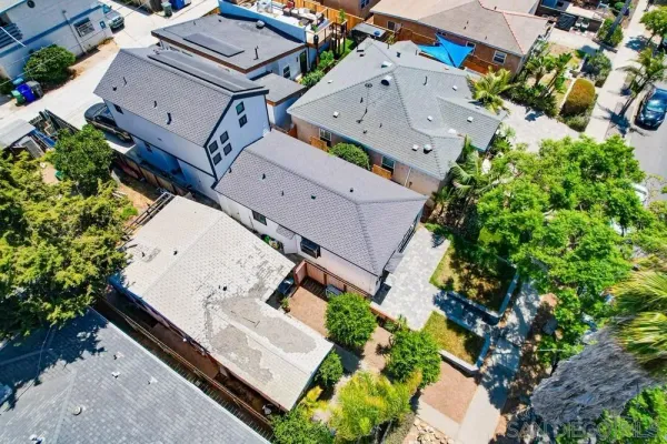 an aerial view of residential building and ocean