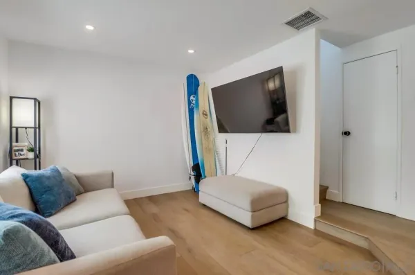 a living room with a couch and a flat screen tv