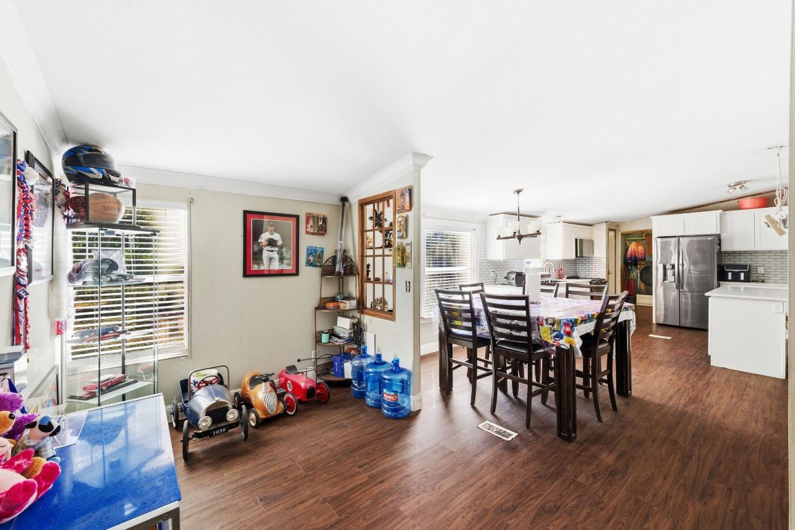 1485 Pettytown Road Dale, TX 78616 - Photo 18 of 36 a view of a livingroom with furniture and wooden floor