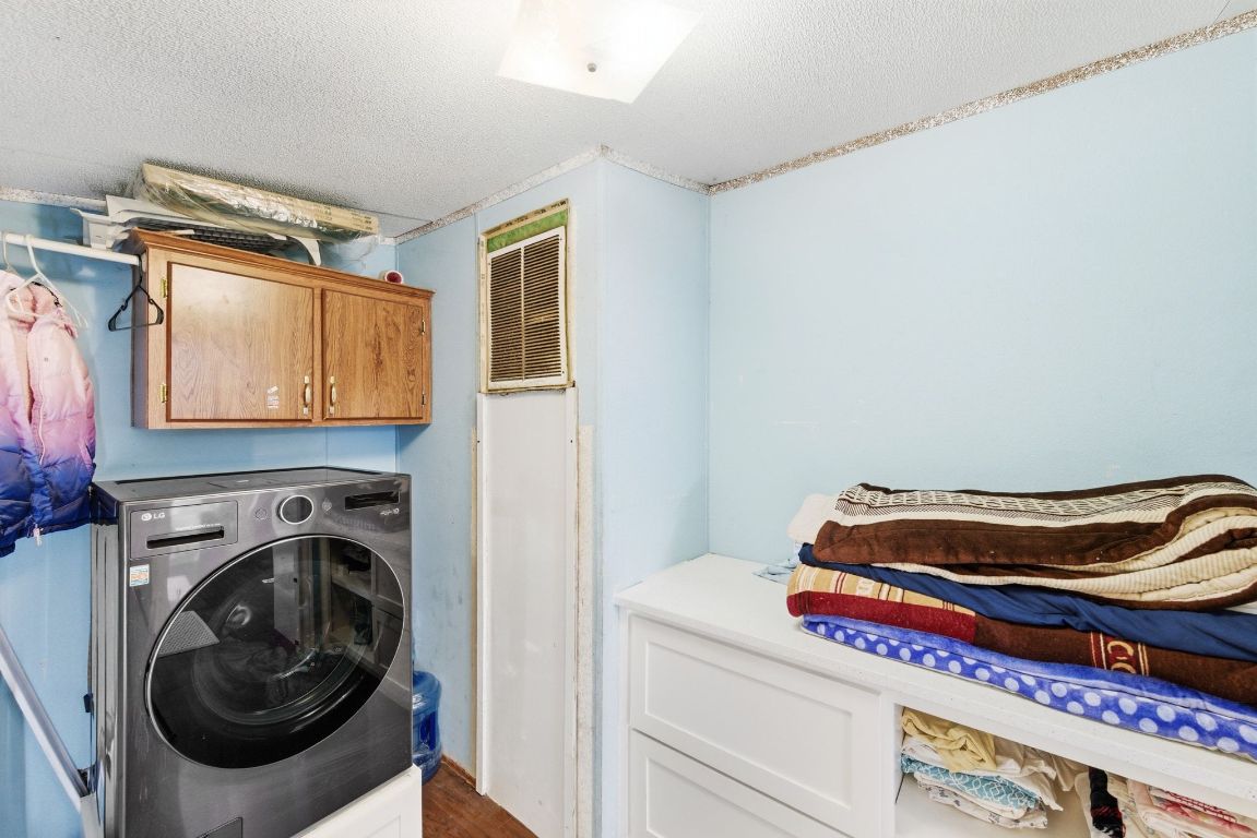 1485 Pettytown Road Dale, TX 78616 - Photo 24 of 36 a utility room with dryer and washer