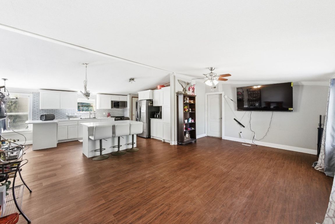 1485 Pettytown Road Dale, TX 78616 - Photo 4 of 36 a view of kitchen with furniture and flat screen tv