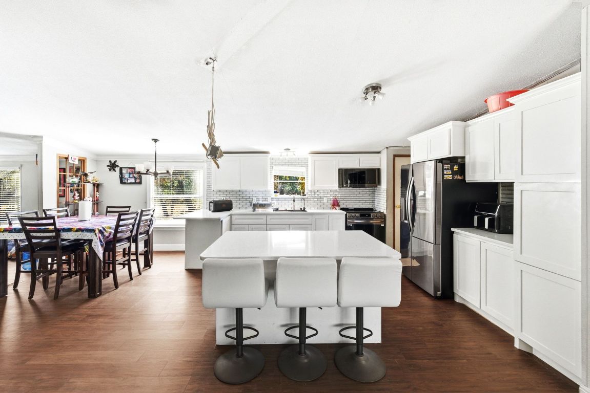 1485 Pettytown Road Dale, TX 78616 - Photo 8 of 36 a large kitchen with a table and chairs