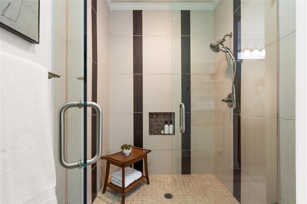 825 Highland Lane Northeast, Unit 1112 Atlanta, GA 30306 - Photo 22 of 39 a bathroom with a shower