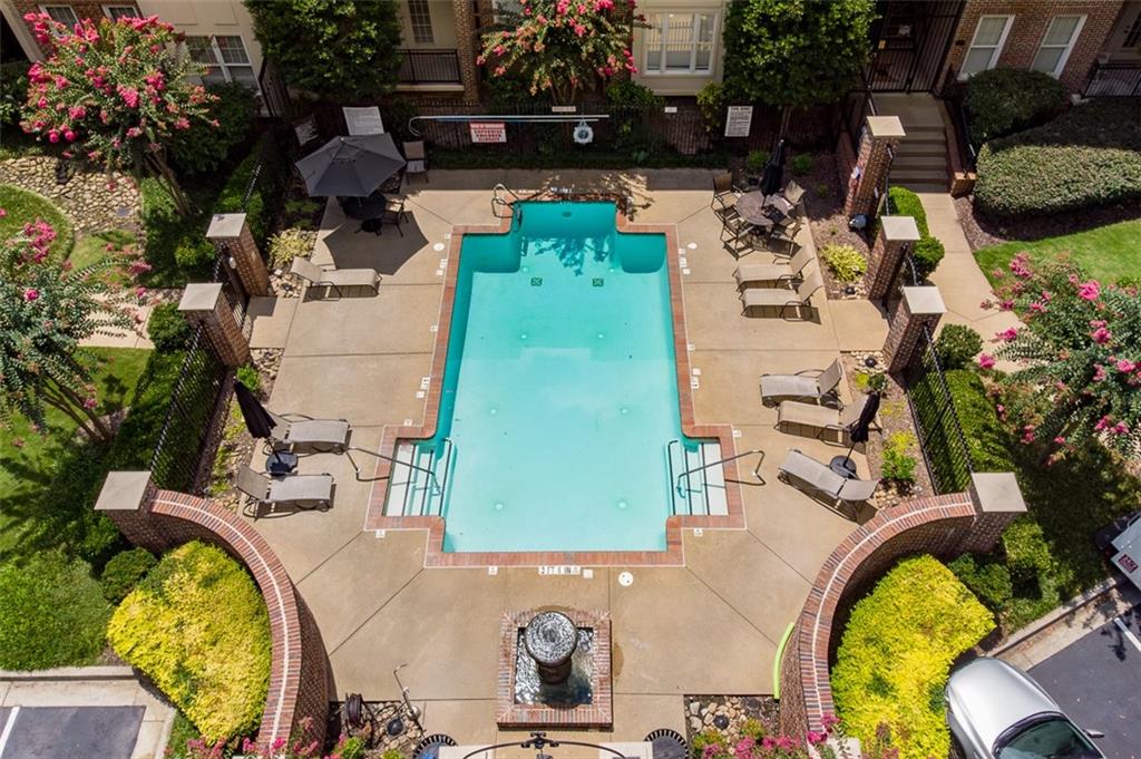 825 Highland Lane Northeast, Unit 1112 Atlanta, GA 30306 - Photo 33 of 39 an aerial view of a house with swimming pool and patio