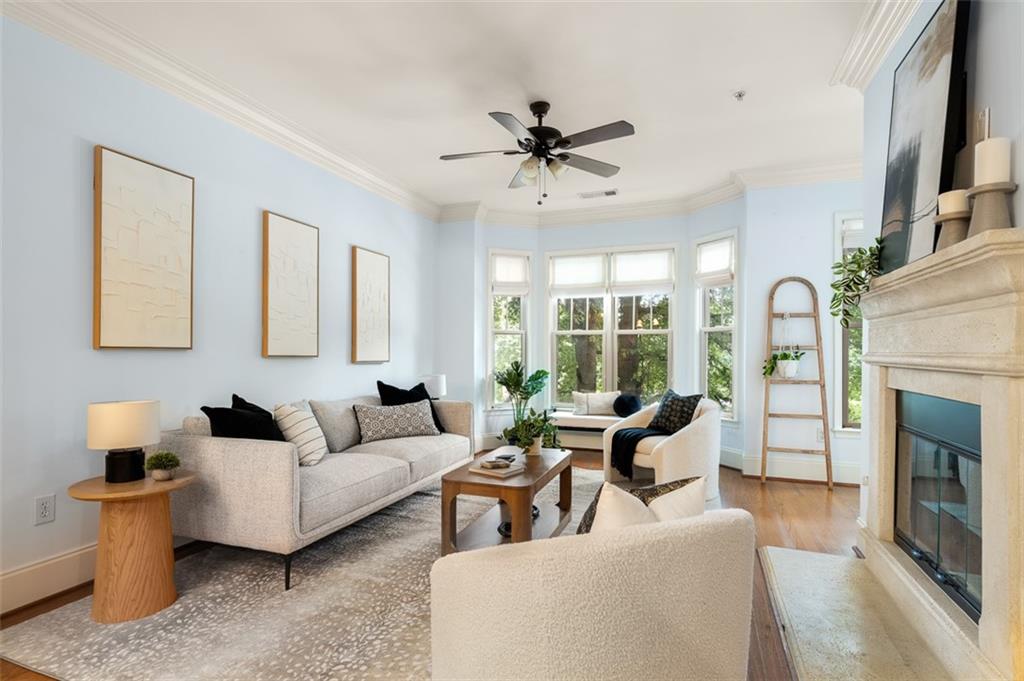 825 Highland Lane Northeast, Unit 1112 Atlanta, GA 30306 - Photo 5 of 39 a living room with furniture and a fireplace