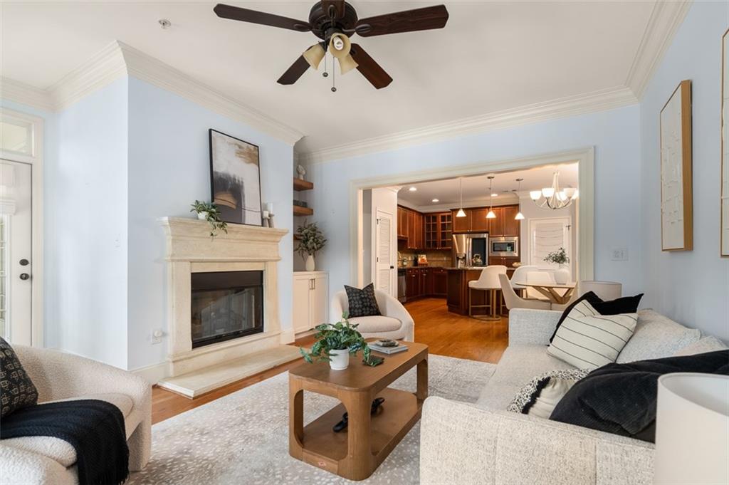 825 Highland Lane Northeast, Unit 1112 Atlanta, GA 30306 - Photo 7 of 39 a living room with furniture and a fireplace