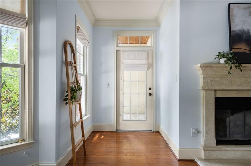 825 Highland Lane Northeast, Unit 1112 Atlanta, GA 30306 - Photo 9 of 39 a view of livingroom with workspace and a fireplace