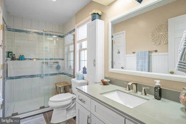 a bathroom with a shower and a toilet