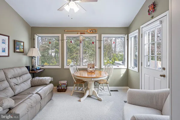 a view of balcony with a table and chairs