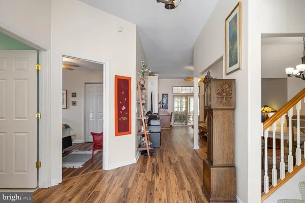 a view of a hallway view with wooden floor and staircase