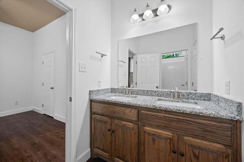 2526 Fox Point Circle Quinlan, TX 75474 - Photo 25 of 35 Auxiliary full bath includes dual sinks