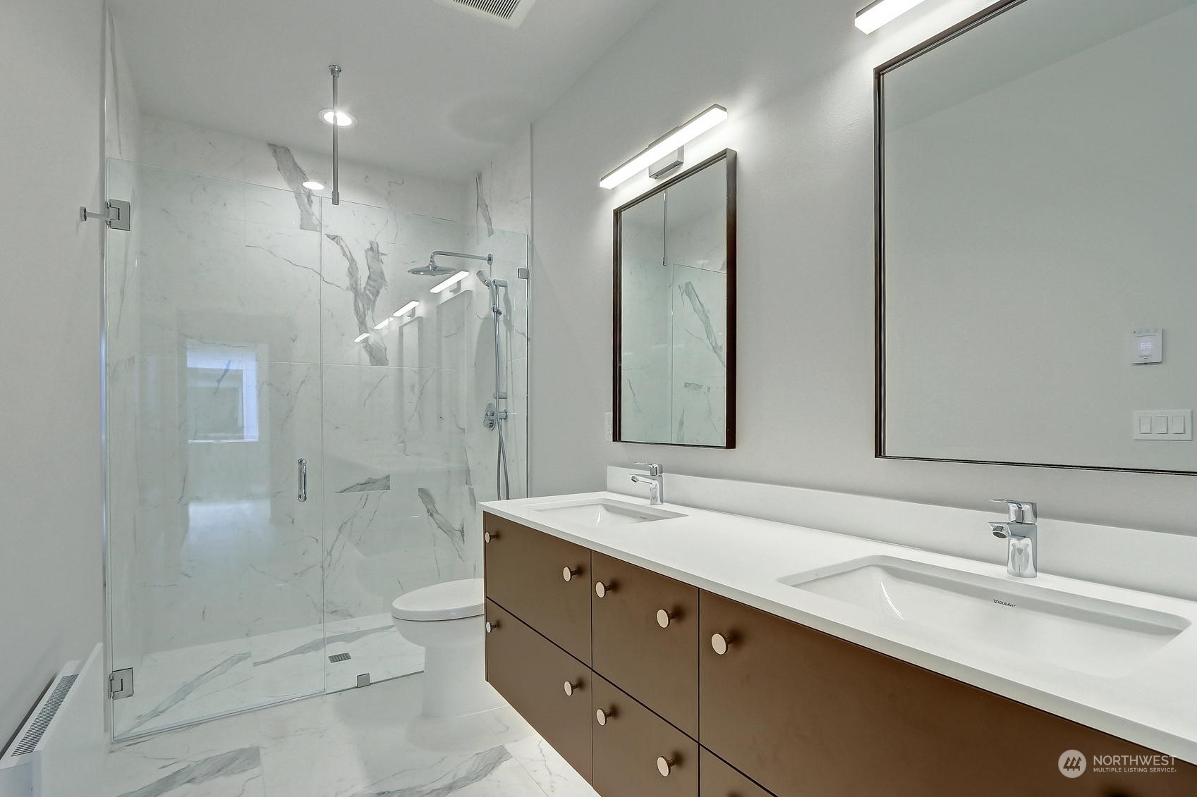 17342 Bothell Way Northeast, Unit H Bothell, WA 98011 - Photo 11 of 19 a bathroom with a double vanity sink mirror double shower and a toilet