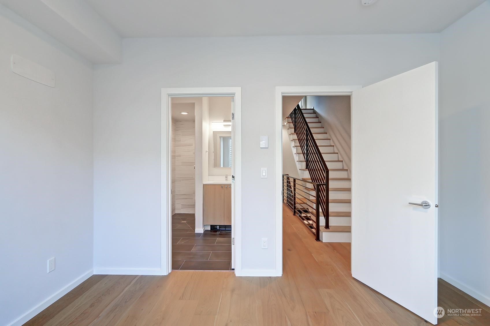 17342 Bothell Way Northeast, Unit H Bothell, WA 98011 - Photo 12 of 19 a view of a hallway with wooden floor and closet