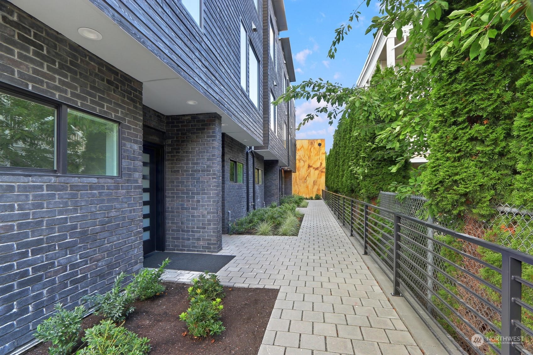 17342 Bothell Way Northeast, Unit H Bothell, WA 98011 - Photo 18 of 19 a view of a pathway that has potted plants