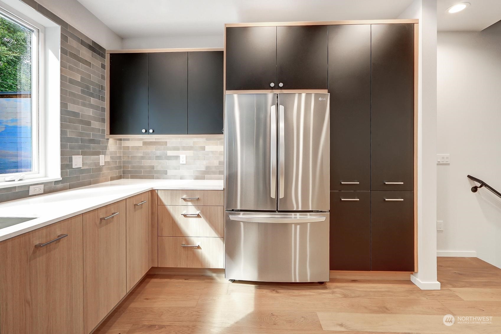 17342 Bothell Way Northeast, Unit H Bothell, WA 98011 - Photo 4 of 19 a kitchen with stainless steel appliances granite countertop a refrigerator and a sink