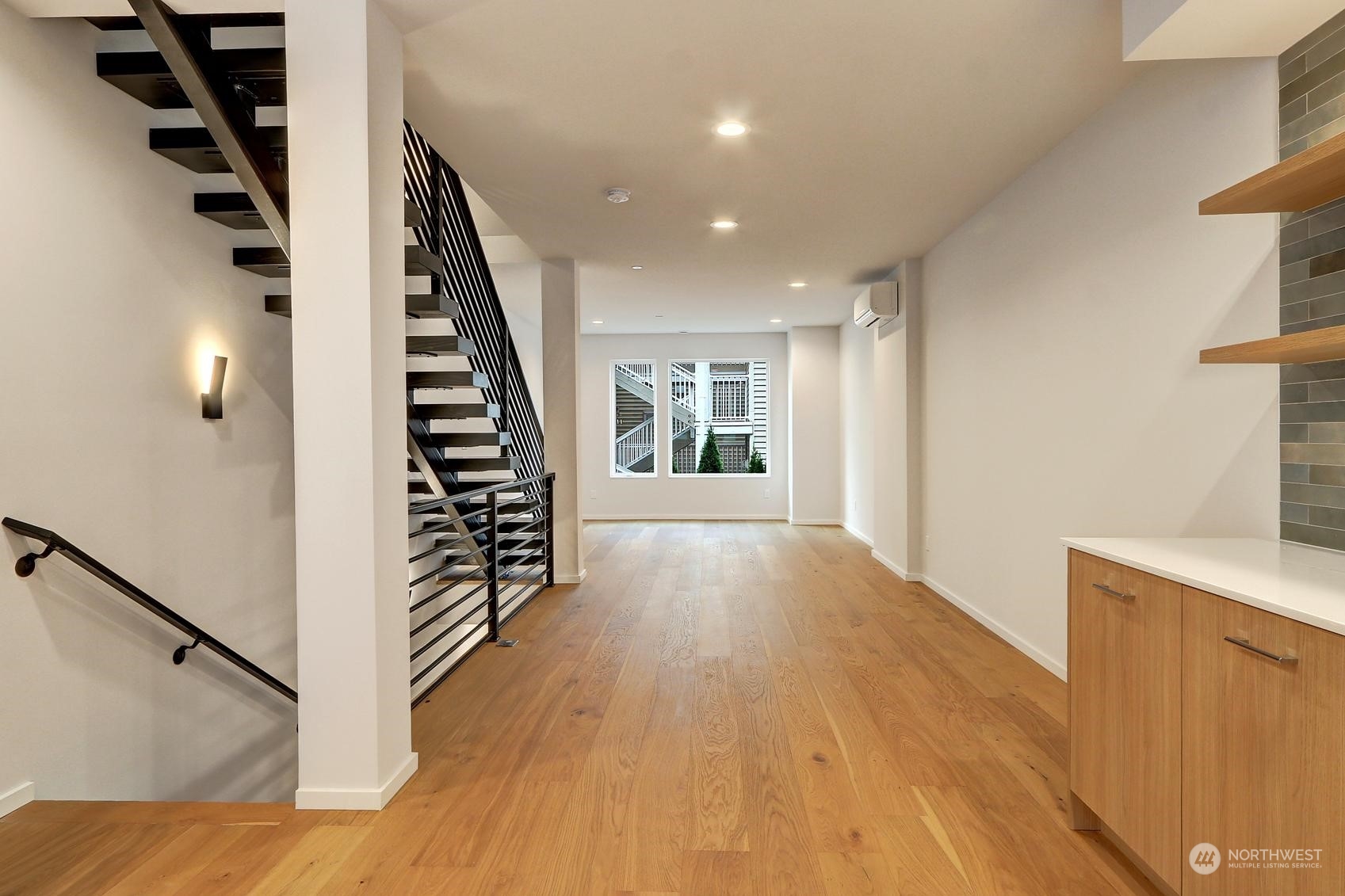 17342 Bothell Way Northeast, Unit H Bothell, WA 98011 - Photo 8 of 19 a view of entryway with wooden floor