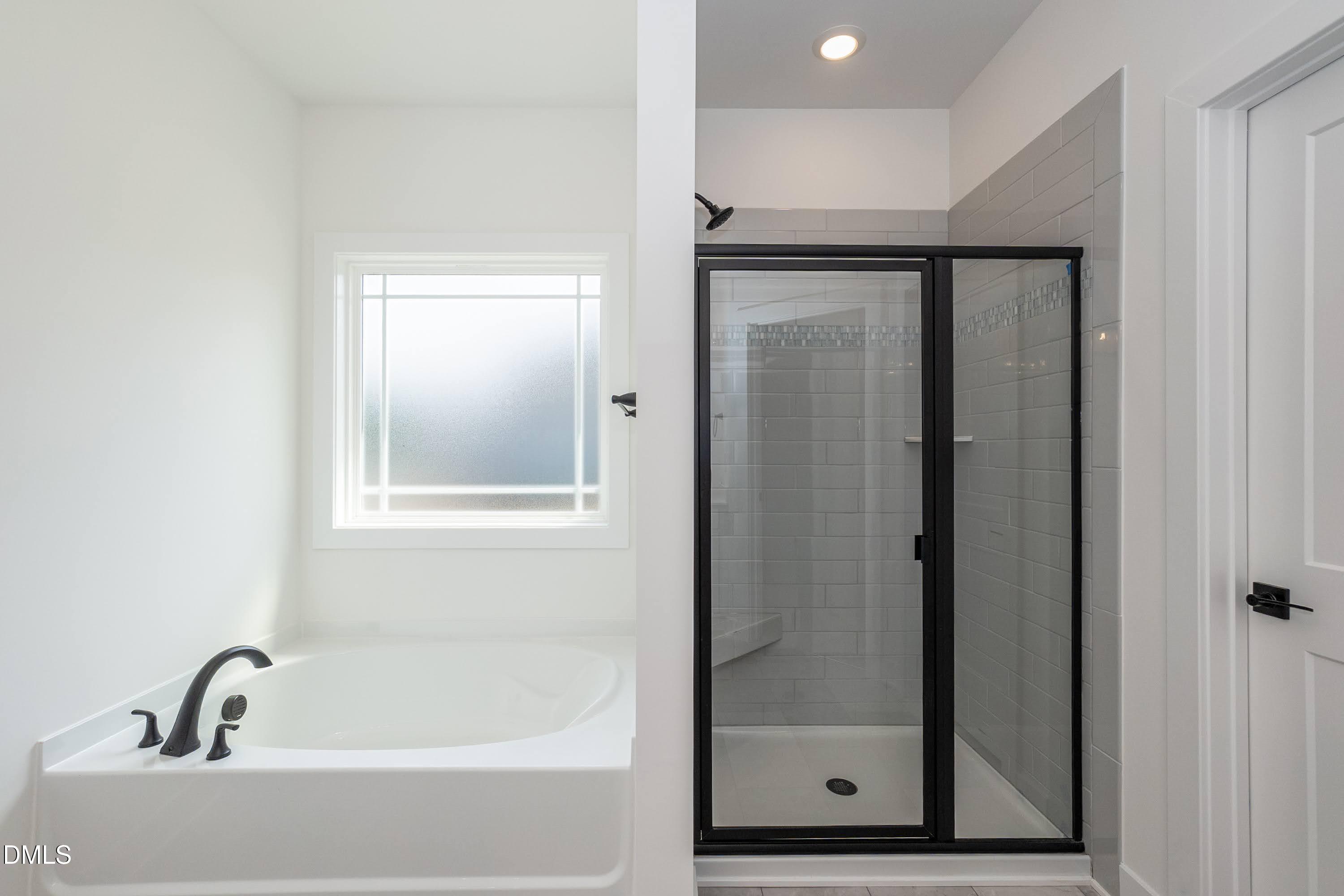 180 Galway Road Lillington, NC 27546 - Photo 25 of 41 a bathroom with a bathtub and shower