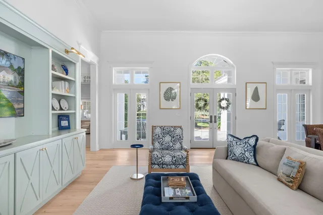 a living room with furniture windows and a fireplace