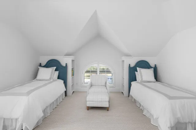 a front view of a house with a yard and a garage