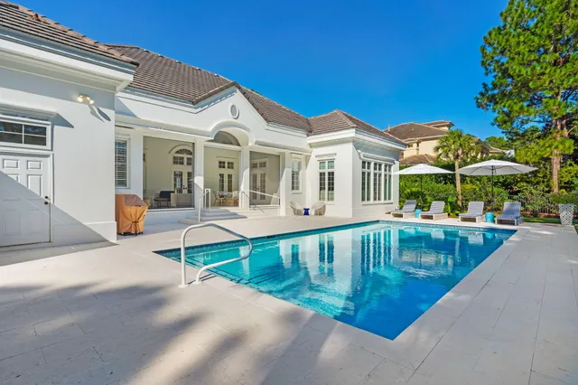a aerial view of a house with a yard and plants