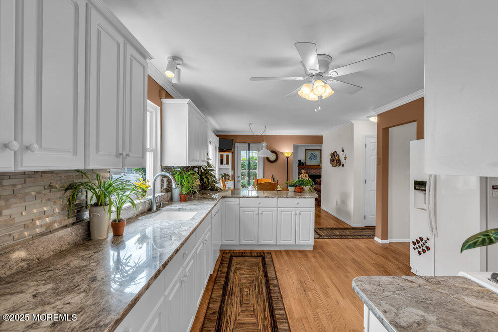 3 Harbor View Lane Toms River, NJ 08753 - Photo 11 of 61 a living room with furniture and a potted plant