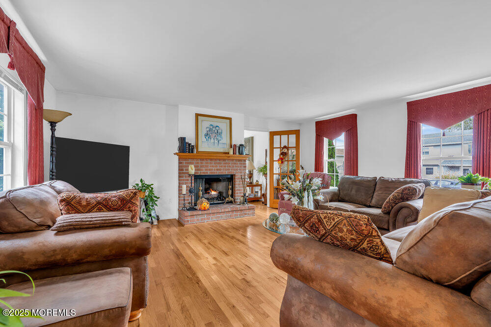 3 Harbor View Lane Toms River, NJ 08753 - Photo 22 of 61 a living room with furniture and a fireplace