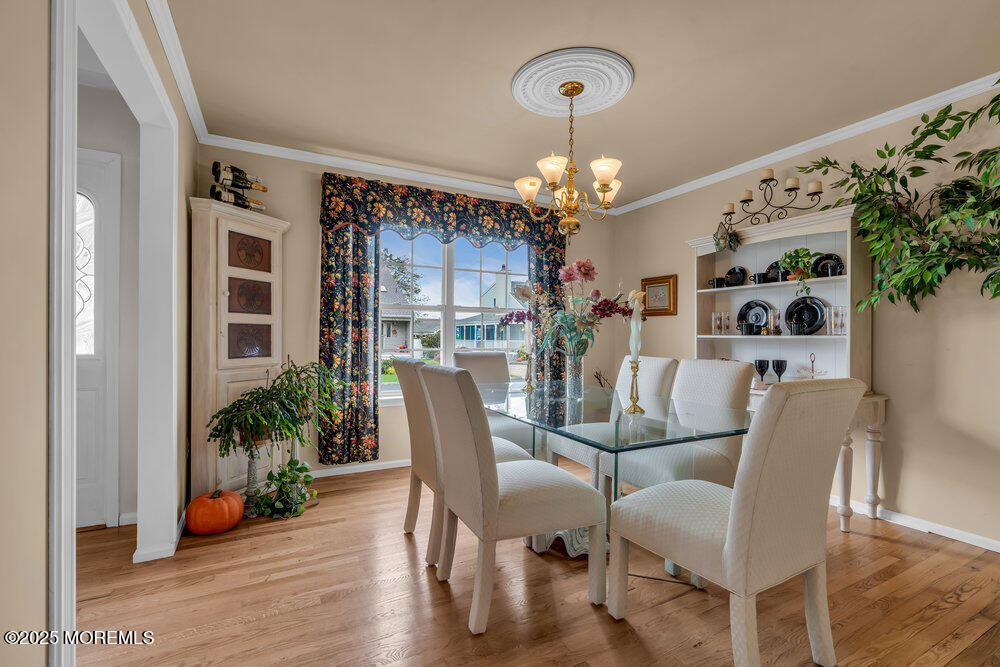 3 Harbor View Lane Toms River, NJ 08753 - Photo 8 of 61 a view of a dining room with furniture and wooden floor