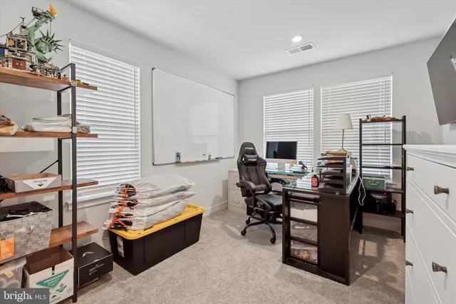 a workspace with furniture and a window