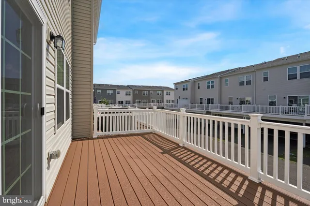 a view of balcony with wooden floor