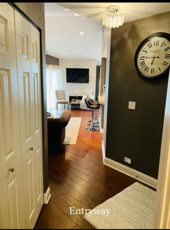 a view of living room with furniture and a flat screen tv