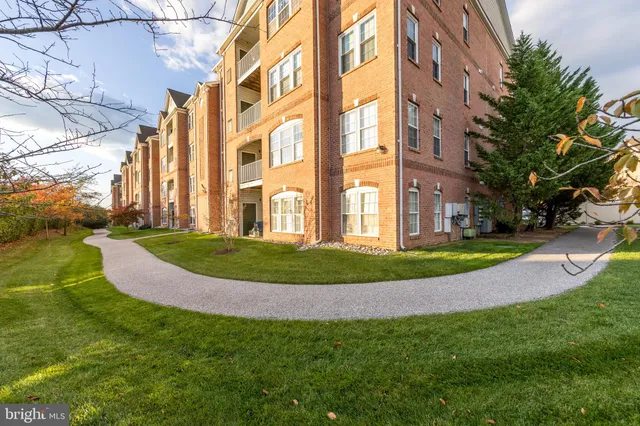 a view of a building with a yard