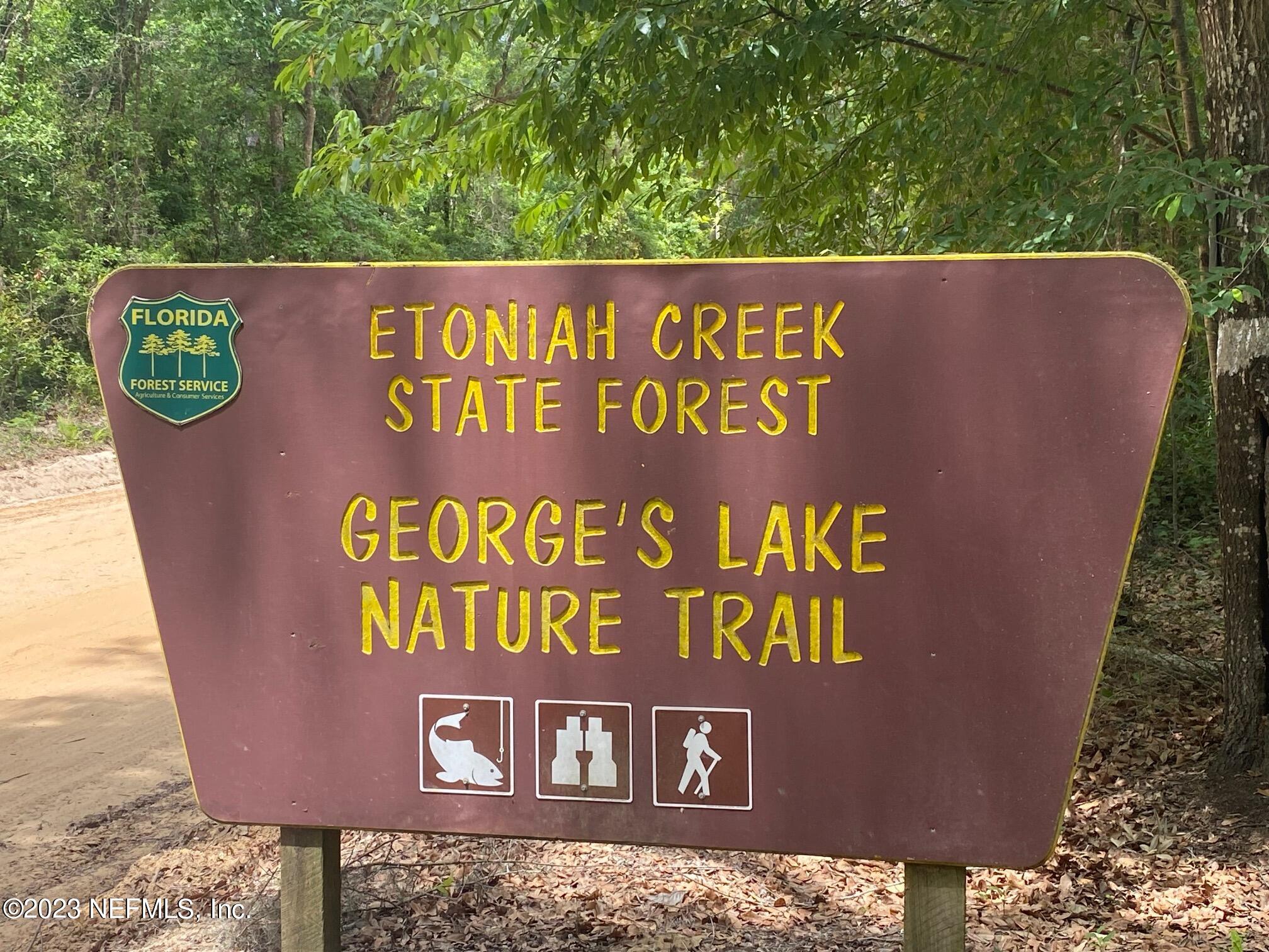 102 Sculpin Drive Florahome, FL 32140 - Photo 16 of 21 a sign broad on wooden wall