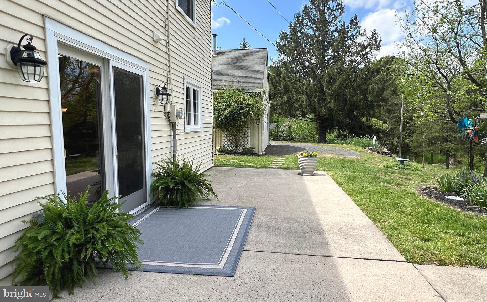 562 Headquarters Road Ottsville, PA 18942 - Photo 33 of 44 Back patio with a view of the detached garage