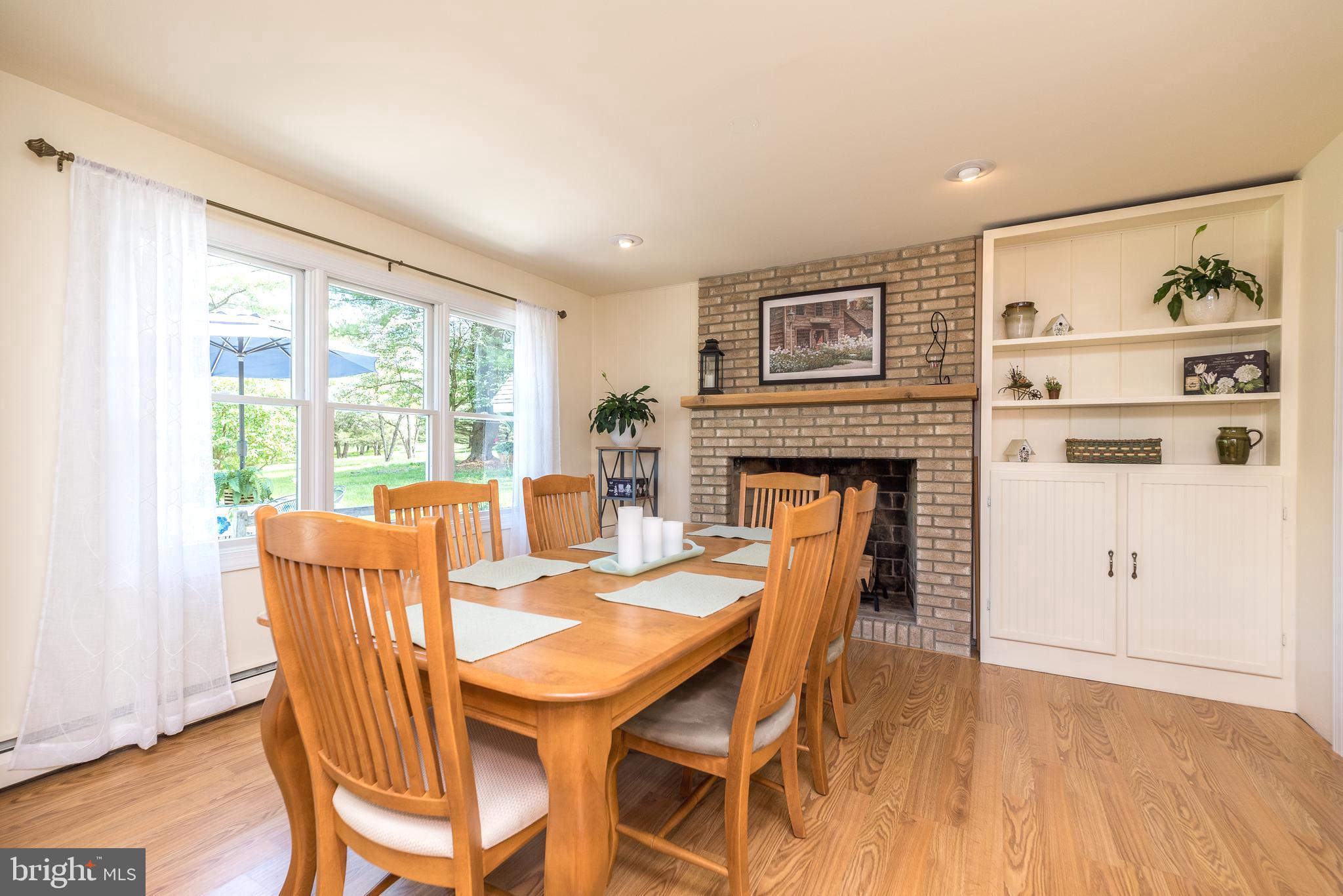 562 Headquarters Road Ottsville, PA 18942 - Photo 6 of 44 Dining area with brick wood-burning fireplace