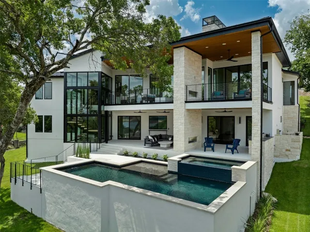 a view of house with outdoor space and swimming pool