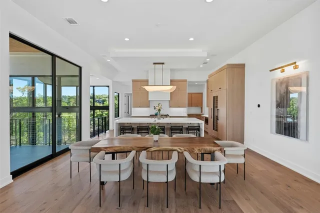 a kitchen with a table and chairs in it