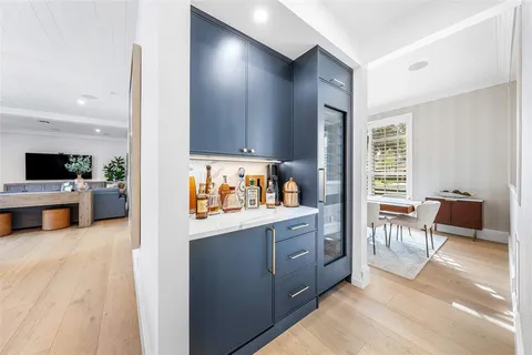 a bathroom with a granite countertop sink a toilet and shower