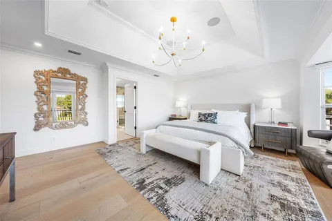 a bathroom with a granite countertop sink toilet and a mirror