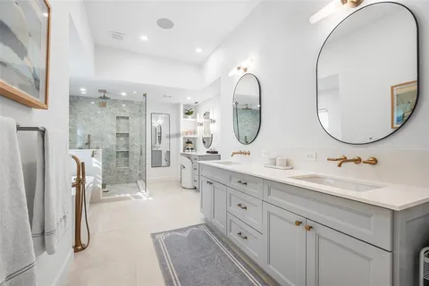 a utility room with sink dryer and washer