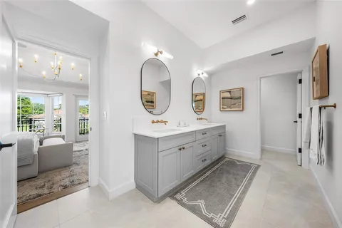 a front view of a house with a garden and swimming pool