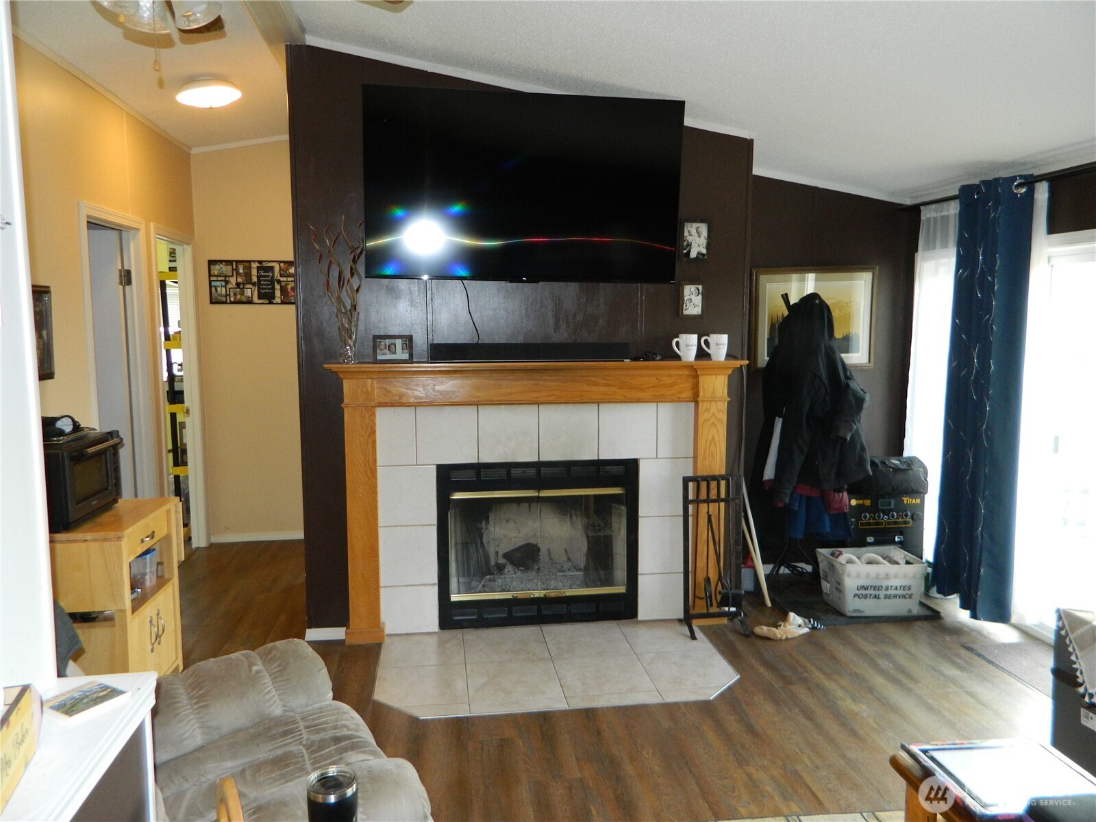 28 Ridgeline Road Tonasket, WA 98855 - Photo 15 of 19 a living room with furniture and a fireplace