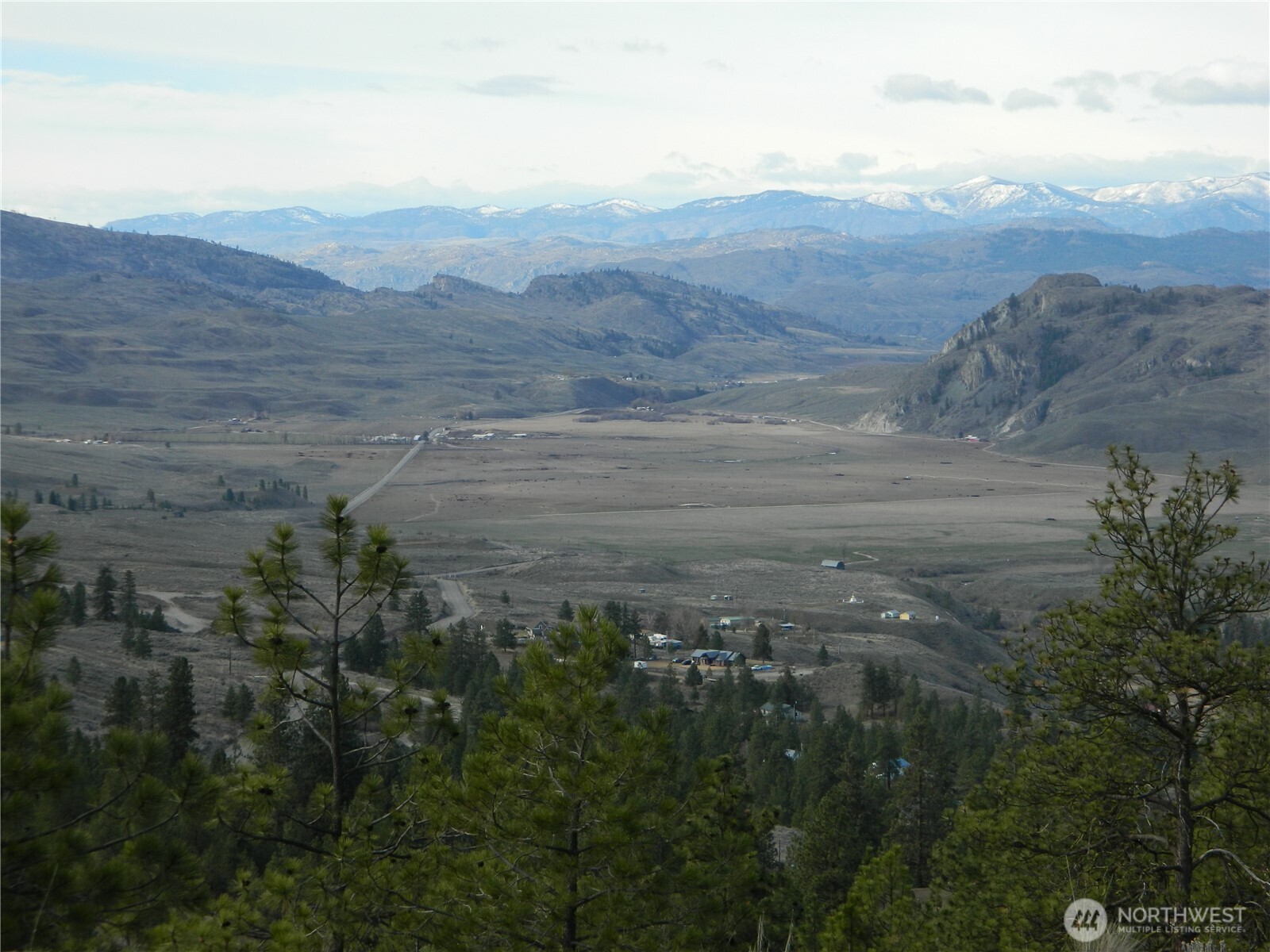 28 Ridgeline Road Tonasket, WA 98855 - Photo 9 of 19 a view of a lush green hillside and a mountain