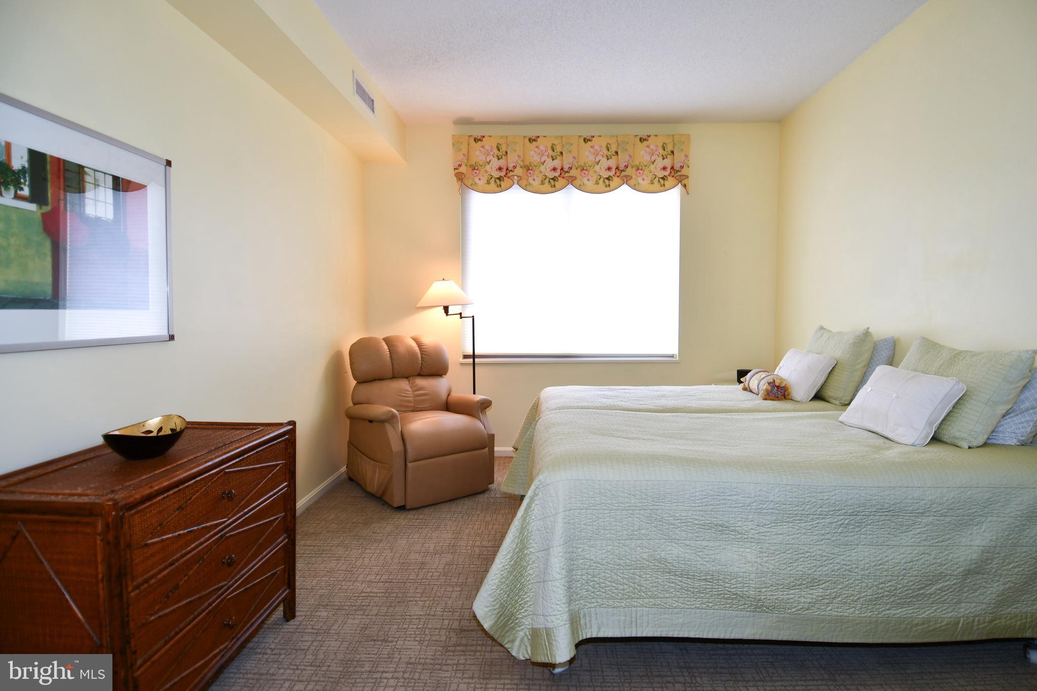 3210 North Leisure World Boulevard, Unit 519 Silver Spring, MD 20906 - Photo 18 of 64 a bedroom with a bed and window