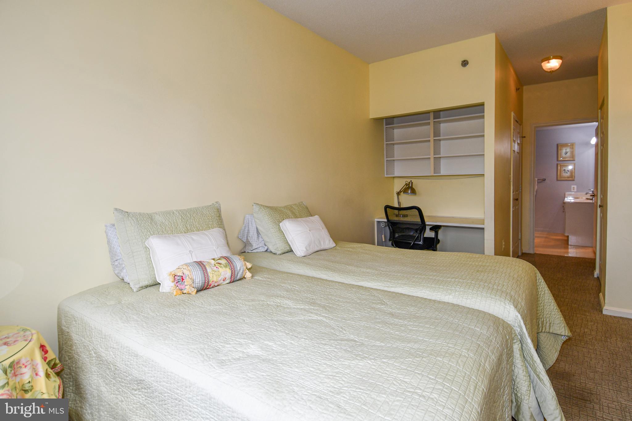 3210 North Leisure World Boulevard, Unit 519 Silver Spring, MD 20906 - Photo 20 of 64 a bedroom with a bed and wooden floor