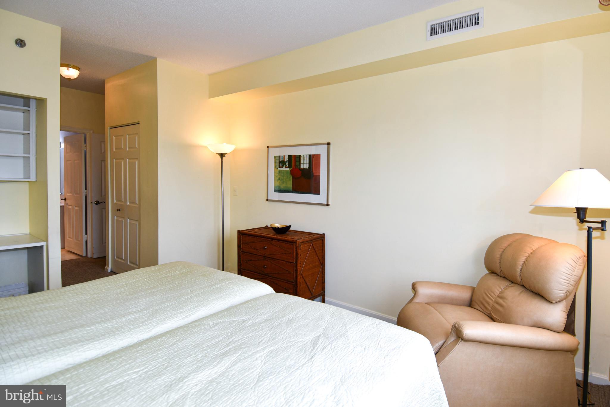 3210 North Leisure World Boulevard, Unit 519 Silver Spring, MD 20906 - Photo 21 of 64 a bedroom with a bed and a couch