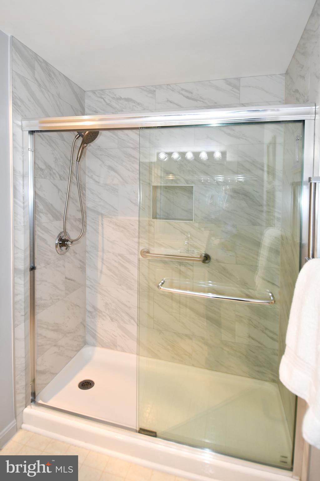 3210 North Leisure World Boulevard, Unit 519 Silver Spring, MD 20906 - Photo 25 of 64 a bathroom with a shower
