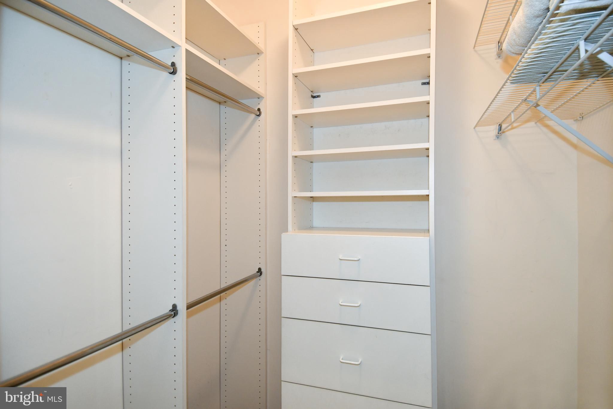 3210 North Leisure World Boulevard, Unit 519 Silver Spring, MD 20906 - Photo 26 of 64 a view of walk in closet with empty racks